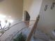 Carpeted staircase with decorative chandelier and railing at 518 Zircon Way, Superior, CO 80027