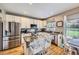 Modern kitchen with stainless steel appliances, granite countertops, and a center island with seating at 9264 Fox Fire Ln, Highlands Ranch, CO 80129