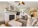Comfortable living room with a fireplace, and decor, and a staircase leading to the upper level at 9264 Fox Fire Ln, Highlands Ranch, CO 80129