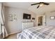 Main bedroom boasts a ceiling fan, a window with blinds, and a dresser with decor at 9264 Fox Fire Ln, Highlands Ranch, CO 80129