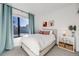 Comfortable bedroom with a full-sized bed, white bedding, and art accents at 3011 W 53Rd Ave, Denver, CO 80221