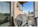 Covered patio with a grill and privacy from neighbors, perfect for outdoor living at 3011 W 53Rd Ave, Denver, CO 80221