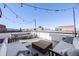 Rooftop patio with views, stylish seating, a dining area, and string lights at 3011 W 53Rd Ave, Denver, CO 80221