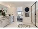 Modern bathroom with dual sinks, stylish decor, and a glass-enclosed shower at 16947 W 92Nd Dr, Arvada, CO 80007
