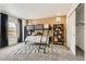 Bright bedroom featuring a bunk bed, decor shelving, plush carpet, and a patterned area rug at 16947 W 92Nd Dr, Arvada, CO 80007