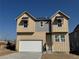 Charming two-story home with a two-car garage and modern architectural details at 16947 W 92Nd Dr, Arvada, CO 80007