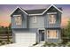 Charming two-story home with neutral siding and modern architectural details at 16947 W 92Nd Dr, Arvada, CO 80007