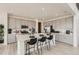 Modern kitchen with stainless steel appliances, a large island, and ample cabinet space at 16947 W 92Nd Dr, Arvada, CO 80007