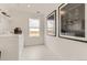 Bright laundry room featuring bright white paint and stainless steel washer and dryer at 16947 W 92Nd Dr, Arvada, CO 80007