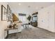 Bright living room area featuring a modern-styled sectional sofa, decorative artworks, and plush carpeting at 16947 W 92Nd Dr, Arvada, CO 80007
