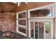 A unique view from the balcony windows showing natural rock formations adding architectural interest at 6619 Apache Pl, Larkspur, CO 80118