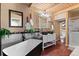 Modern bathroom with standalone tub, black fixtures, wood ceiling and dual vanity at 6619 Apache Pl, Larkspur, CO 80118