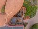 Aerial view of the deck, featuring outdoor seating and a fire pit, all nestled next to a rock formation at 6619 Apache Pl, Larkspur, CO 80118