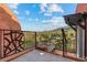 Hot tub on wood deck with lounge chair overlooks expansive wooded valley and mountain range at 6619 Apache Pl, Larkspur, CO 80118