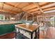 Kitchen featuring an island, hardwood floors, and stainless steel appliances at 6619 Apache Pl, Larkspur, CO 80118