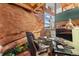 Modern home office space featuring rock accent wall, built in lighting and desk at 6619 Apache Pl, Larkspur, CO 80118