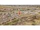 Aerial view of townhomes with nearby businesses, highways, and open fields at 22898 E Ottawa Pl, Aurora, CO 80016