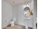 Half bathroom featuring updated pedestal sink and fixtures, and updated flooring at 22898 E Ottawa Pl, Aurora, CO 80016