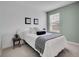Cozy bedroom with soft lighting, white linens, and a decorative throw blanket at 22898 E Ottawa Pl, Aurora, CO 80016
