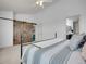 Bright bedroom featuring vaulted ceilings, natural light, and walk-in closet at 22898 E Ottawa Pl, Aurora, CO 80016
