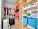 Walk-in closet with built-in shelving and ample storage space at 22898 E Ottawa Pl, Aurora, CO 80016