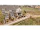 Exterior view of townhomes with well-maintained landscaping and attractive facades at 22898 E Ottawa Pl, Aurora, CO 80016