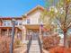 Charming townhome with stone accents and a welcoming front porch, enhanced by a vibrant American flag at 22898 E Ottawa Pl, Aurora, CO 80016