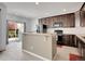 Bright kitchen featuring an island, granite countertops, and stainless steel appliances at 22898 E Ottawa Pl, Aurora, CO 80016