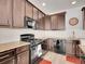 Kitchen with granite countertops, stainless steel appliances, and tile backsplash at 22898 E Ottawa Pl, Aurora, CO 80016
