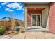Backyard featuring a patio, grass, and decorative vegetation at 5876 Alton St, Denver, CO 80238
