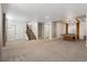 Finished basement with carpet flooring and a billiard table underneath modern lighting at 5876 Alton St, Denver, CO 80238