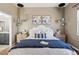 Bedroom featuring modern light fixtures and stylish decor at 5876 Alton St, Denver, CO 80238