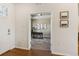 Bright entryway featuring hardwood floors, white trim, and an office view at 5876 Alton St, Denver, CO 80238