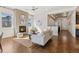 Inviting living room with a cozy fireplace, hardwood floors, and an open floor plan at 5876 Alton St, Denver, CO 80238