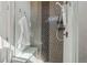 Stylish shower with modern fixtures and mosaic tile at 5876 Alton St, Denver, CO 80238