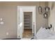 A well-organized walk-in closet featuring built-in shelving for efficient storage at 5876 Alton St, Denver, CO 80238