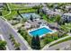 Community pool, tennis courts, playground, and parking area at 9535 S Shadow Hill Cir, Lone Tree, CO 80124