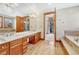 Luxurious bathroom with double vanity and soaking tub at 9535 S Shadow Hill Cir, Lone Tree, CO 80124
