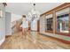 Elegant dining room with hardwood floors and a curved staircase at 9535 S Shadow Hill Cir, Lone Tree, CO 80124