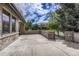 Spacious front patio with stone accents and gated entry at 9535 S Shadow Hill Cir, Lone Tree, CO 80124