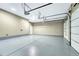 Attached garage with epoxy flooring and automatic opener at 9535 S Shadow Hill Cir, Lone Tree, CO 80124