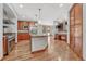 Spacious kitchen featuring island, stainless steel appliances, and hardwood floors at 9535 S Shadow Hill Cir, Lone Tree, CO 80124