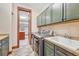 Bright laundry room with washer, dryer, and ample storage at 9535 S Shadow Hill Cir, Lone Tree, CO 80124