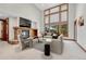 Bright living room with stone fireplace and large windows at 9535 S Shadow Hill Cir, Lone Tree, CO 80124