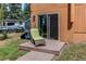 Backyard view showcasing a private patio with outdoor seating and a convenient sliding door entrance at 25257 Snyder Ave, Conifer, CO 80433
