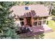 Aerial view showcases the beautiful wooded surroundings of this stunning home at 25257 Snyder Ave, Conifer, CO 80433