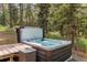 Hot tub nestled in the woods; perfect for relaxation and enjoying the natural surroundings at 25257 Snyder Ave, Conifer, CO 80433