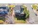 Aerial view of the home highlighting the backyard, patio, deck, and landscaping at 9640 S Johnson St, Littleton, CO 80127