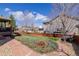 Landscaped backyard featuring a patio, lawn, wooden deck, and privacy fence at 9640 S Johnson St, Littleton, CO 80127
