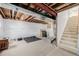 Unfinished basement with exposed ceiling, concrete floors, and potential for customization at 9640 S Johnson St, Littleton, CO 80127